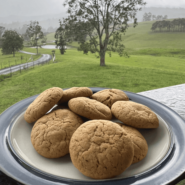 Ataraxis Farms plate of biscuits with a scenic background of green paddocks and trees
