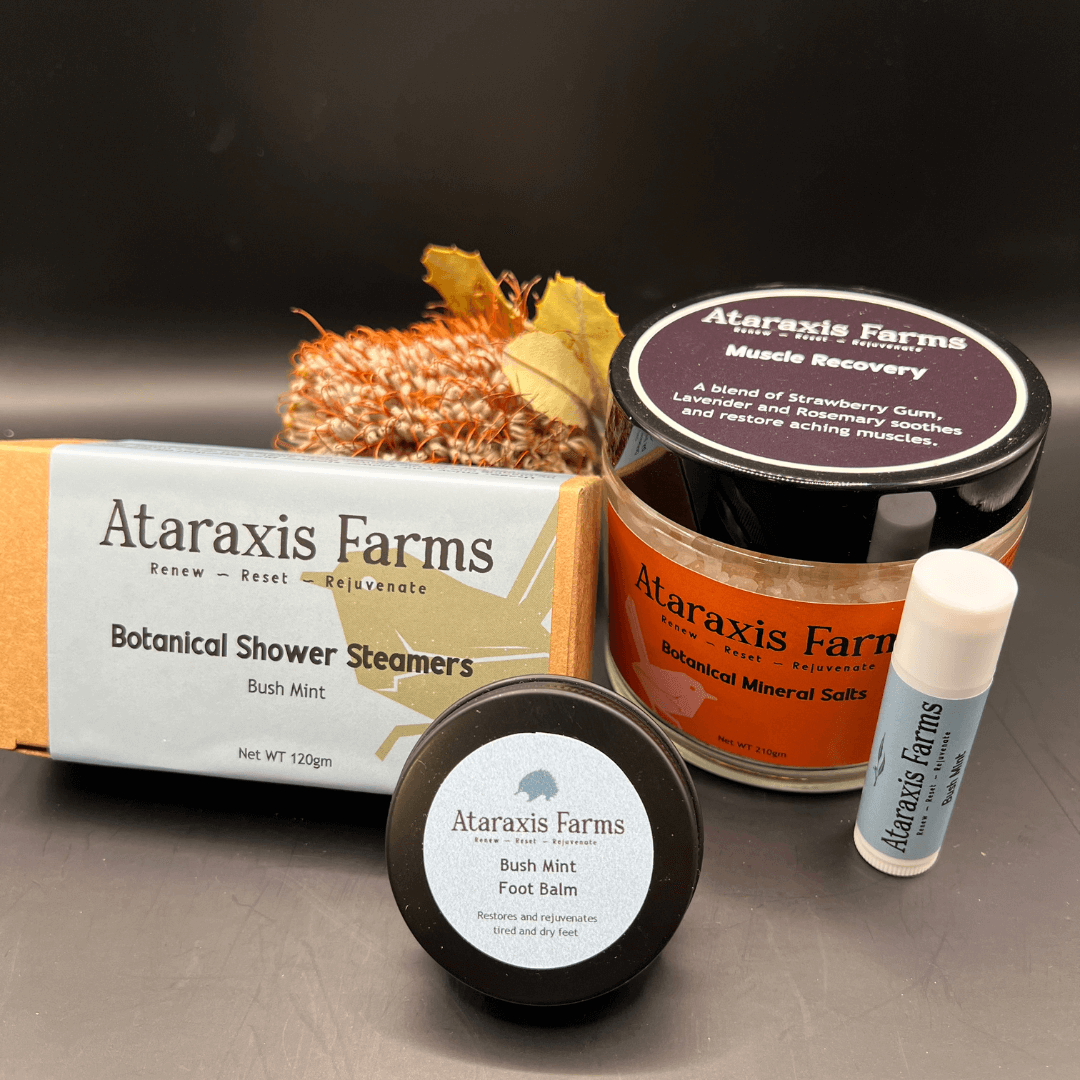 Ataraxis Farms Reset Gift Pack including Botanical Mineral Salts, Bush Mint Foot Balm, Bush Mint Botanical Shower Steamers and Bush Mint Lip Balm.